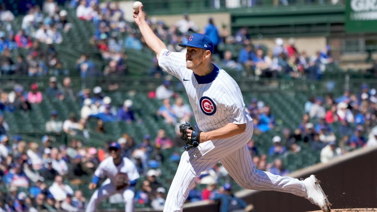 Chicago Cubs starting pitcher Jameson Taillon delivers during the first...
