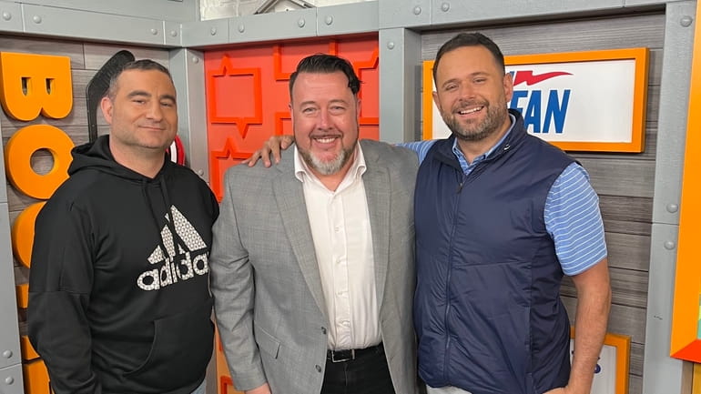 New WFAN program director Ryan Hurley, center, joins Jerry Recco,...