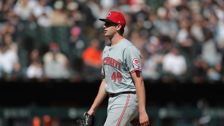 Cincinnati Reds' Nick Lodolo walks back to the dugout after...