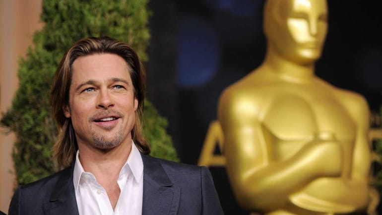 Brad Pitt, a Best Actor nominee for "Moneyball," poses at...