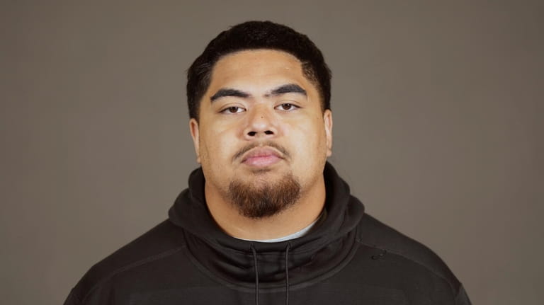Oregon State offensive lineman Taliese Fuaga poses for a portrait...