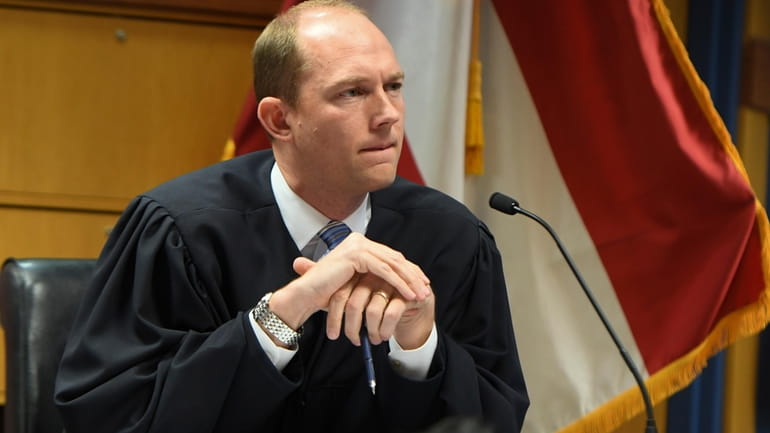 Judge Scott McAfee addresses the lawyers during a hearing on...