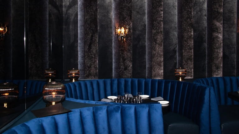 The dark, velvet-clad upstairs dining area at TBar in Roslyn.