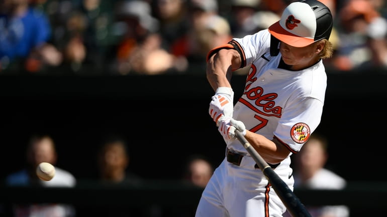 Baltimore Orioles' Jackson Holliday swings for a single during the...