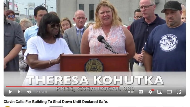 A screenshot of Theresa Kohutka, center, from a Hempstead Town news conference on...