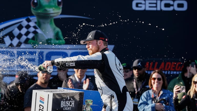 Tyler Reddick celebrates his win at a NASCAR Cup Series...