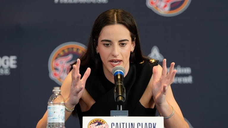 Indiana Fever's Caitlin Clark speaks during a WNBA basketball news...