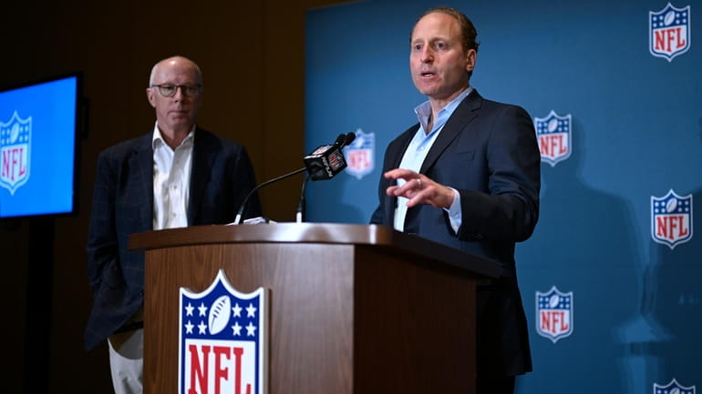 Rich McKay, left, Atlanta Falcons CEO and Competition Committee Chairman,...