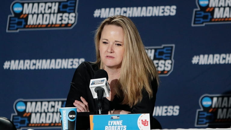 Utah head coach Lynne Roberts speaks during a press conference...