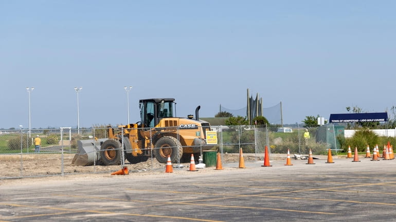 Construction equipment is parked at the former site of Lido...