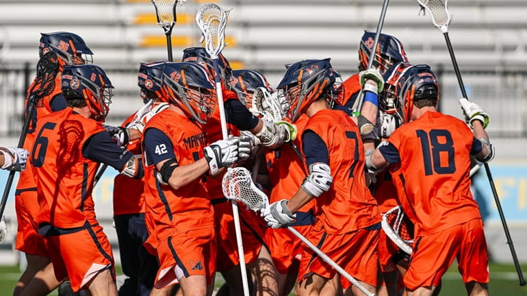Manhasset celebrates its win over Shoreham-Wading River in a non-league...