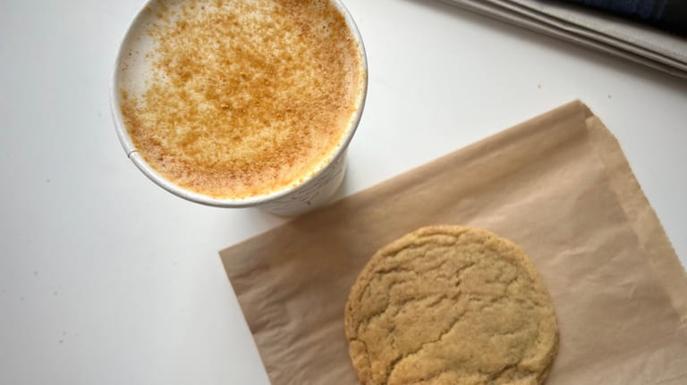 A cereal milk latte and a cinnamon sugar cookie at...