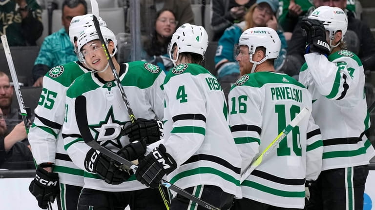 Dallas Stars left wing Jason Robertson, second from left, is...