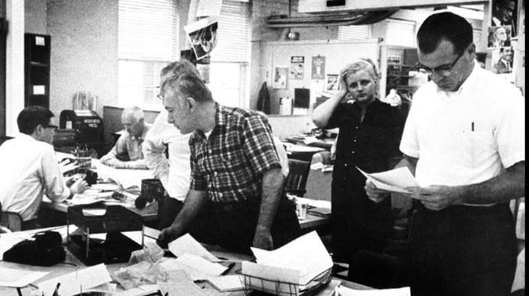 Anthony Insolia, far right, works in the Newsday newsroom on...