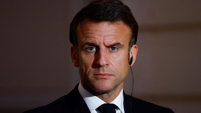 French President Emmanuel Macron looks on during a joint statement...