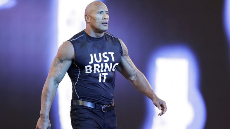 Dwayne "The Rock" Johnson makes his entrance at Wrestlemania XXXI,...