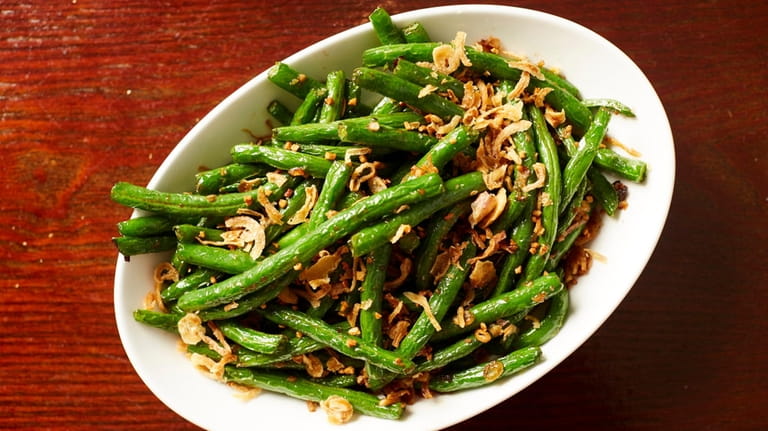 String beans sautéed with black bean sauce and topped with...