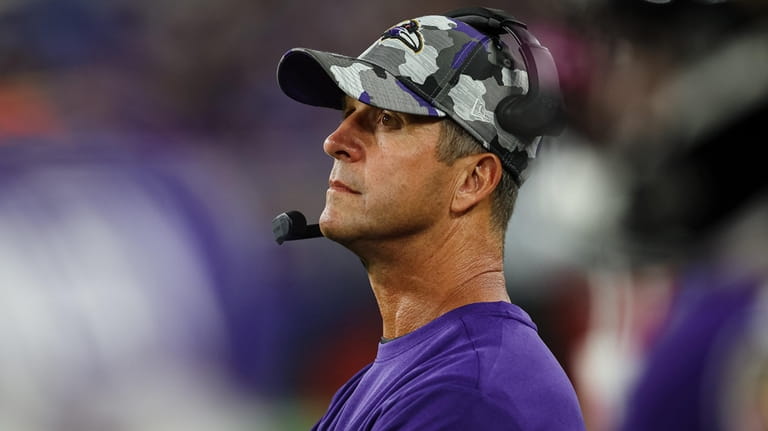 Ravens head coach John Harbaugh looks on from the sidelines...