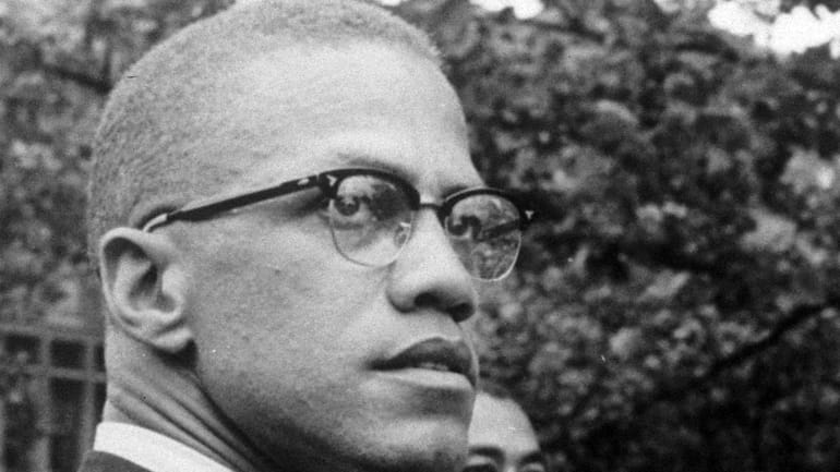 In this 1963 file photo, Malcolm X attends a rally...
