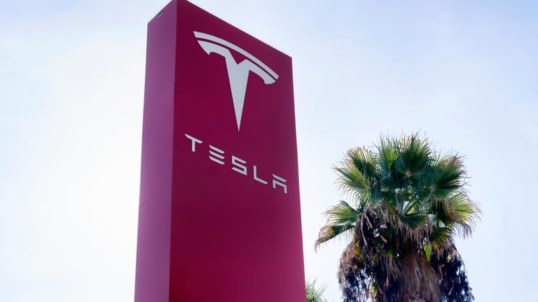 A Tesla sign is seen at Tesla in Buena Park,...