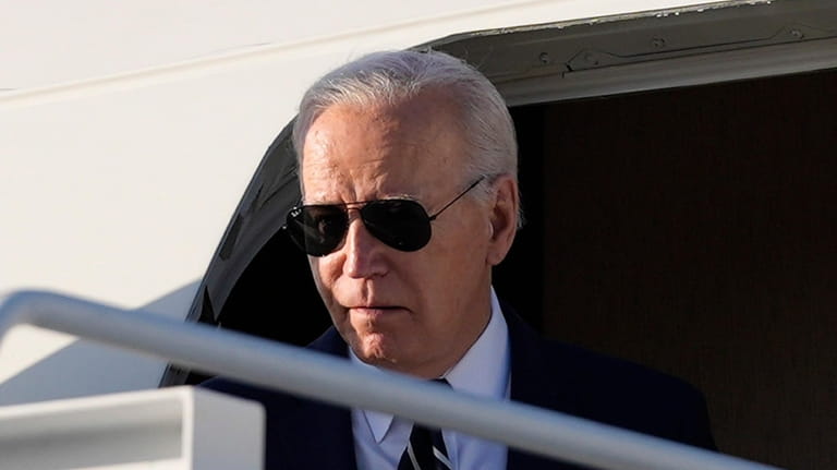 President Joe Biden arrives on Air Force One at Delaware...