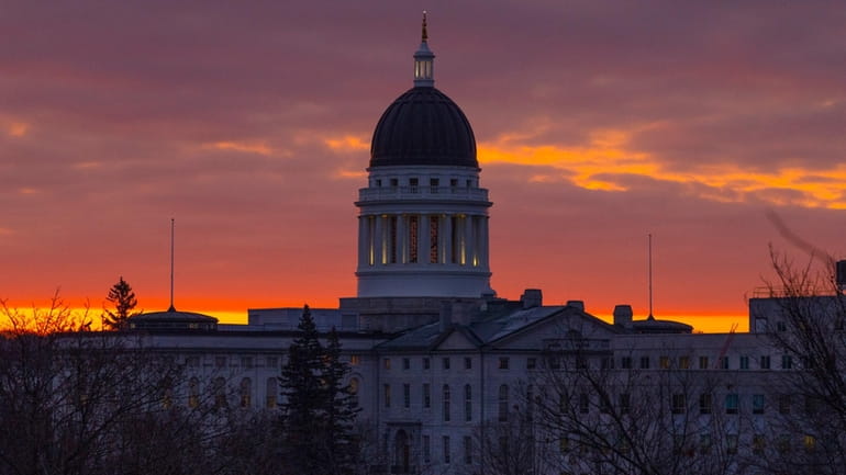 The Maine State House is seen at dawn, Jan. 3,...