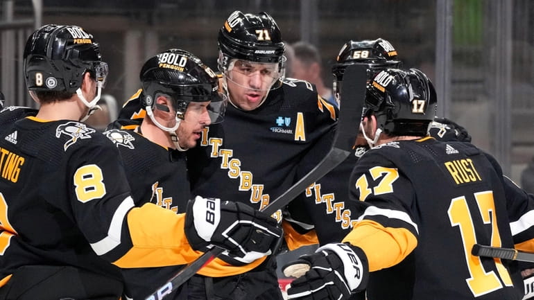 Pittsburgh Penguins' Evgeni Malkin (71) celebrates his first of two...