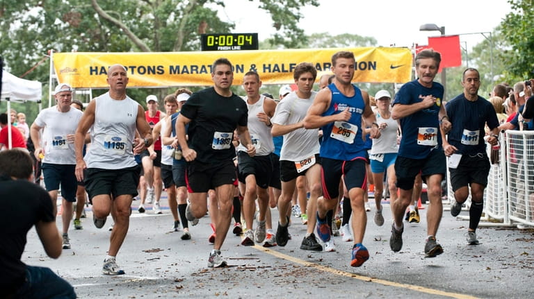 Runners begin the Hamptons Marathon at the Springs School in...