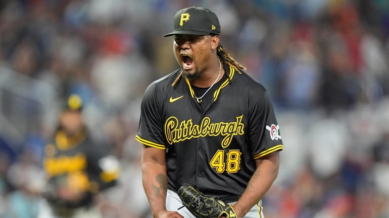 Pittsburgh Pirates starting pitcher Luis Ortiz reacts as he finishes...