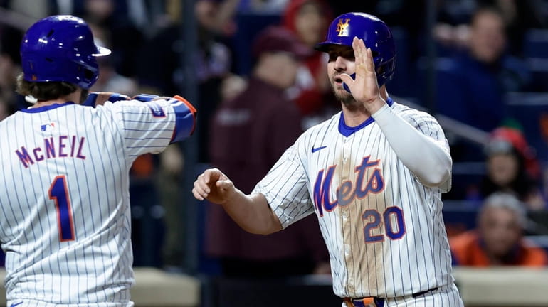 Pete Alonso #20 of the Mets celebrates his seventh inning...