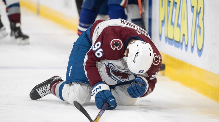 Colorado Avalanche's Mikko Rantanen (96) is injured after being hit...