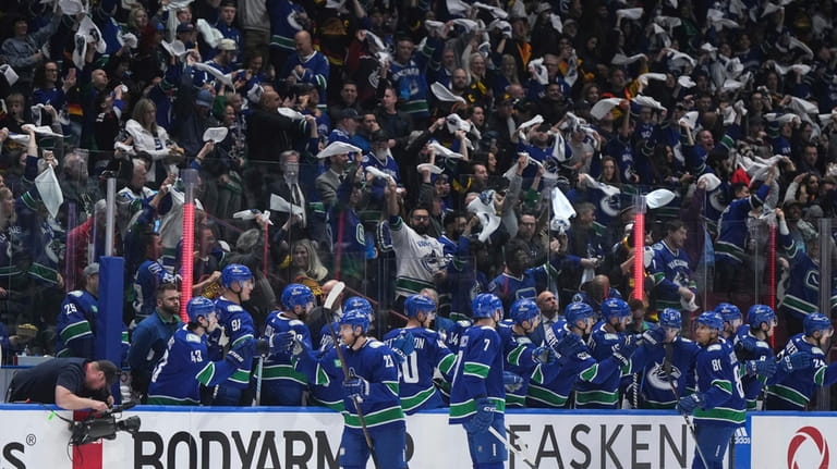 Vancouver Canucks' Elias Lindholm (23) celebrates his goal with the...