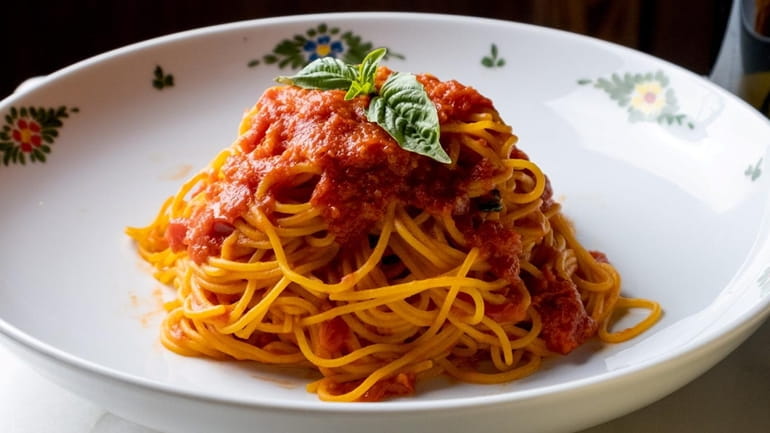 Spaghetti pomodoro topped with basil at Osteria Morini at Roosevelt...