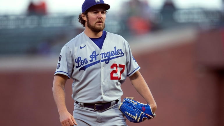 Los Angeles Dodgers starting pitcher Trevor Bauer looks toward home...