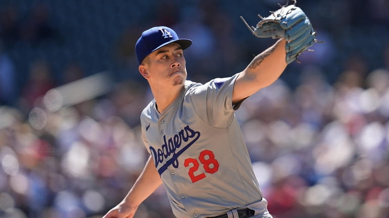Los Angeles Dodgers starting pitcher Bobby Miller (28) delivers during...