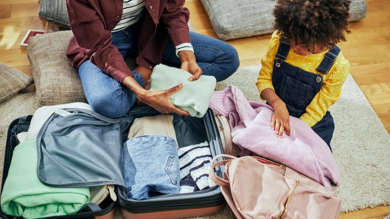 Packing smart for a family vacation can help limit stress...
