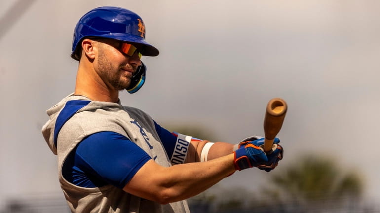 Mets infielder Pete Alonso swings during a spring training workout on Saturday...