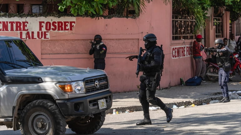Police stop at a car to inspect in Port-au-Prince, Haiti,...