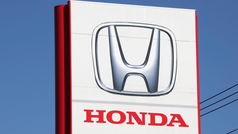 The logo of the Honda Motor Co. is seen in...