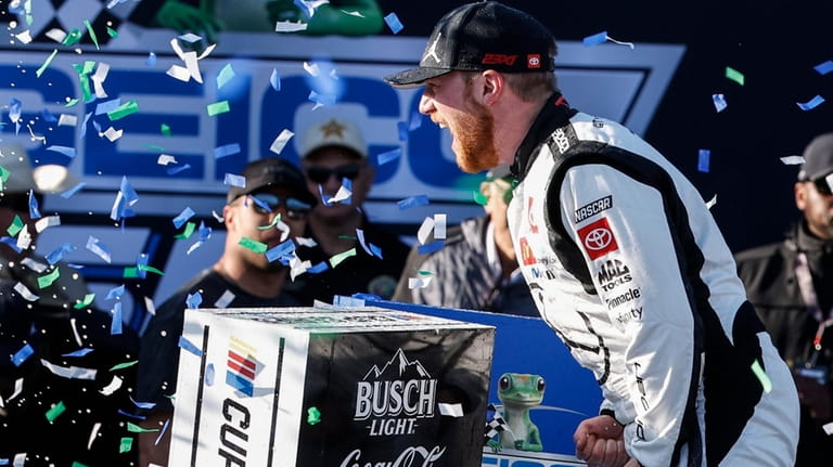 Tyler Reddick celebrates his win at a NASCAR Cup Series...