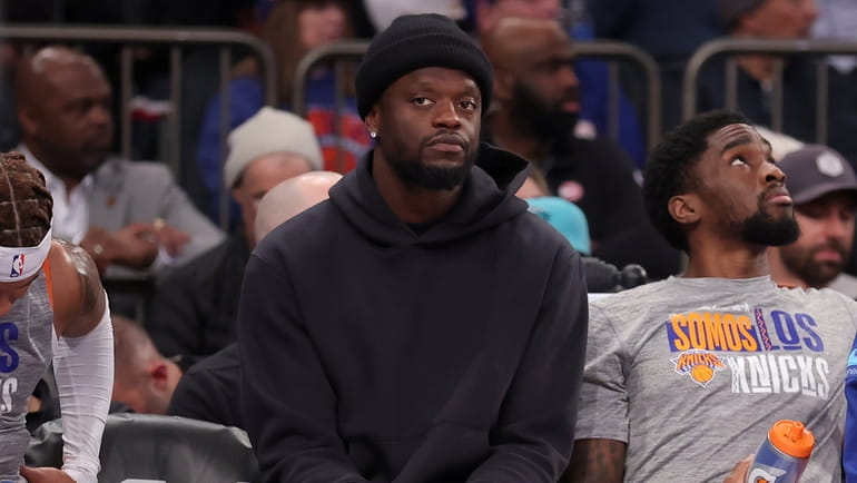 Knicks injured forward Julius Randle (30) watches from the bench...