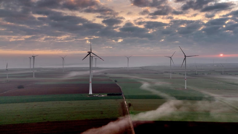Wind turbines operate at an energy plant near Stetten, north...