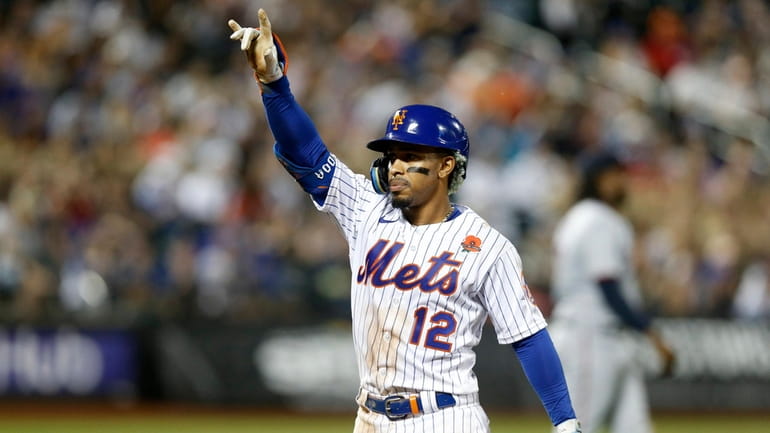 Francisco Lindor #12 of the Mets reacts after his third inning...