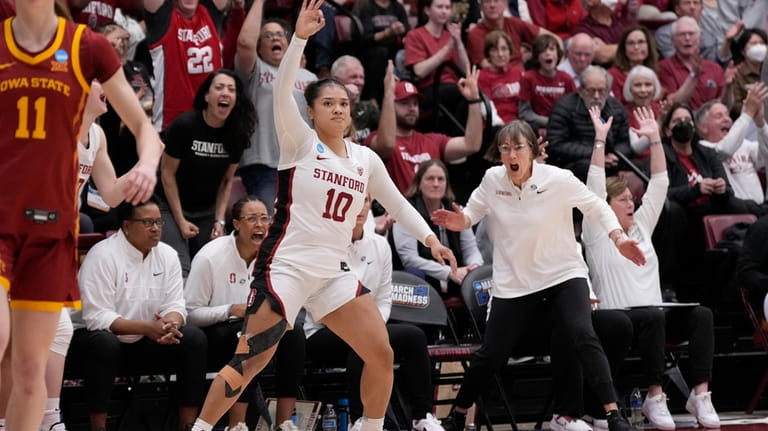Stanford head coach Tara VanDerveer, standing middle right, reacts after...