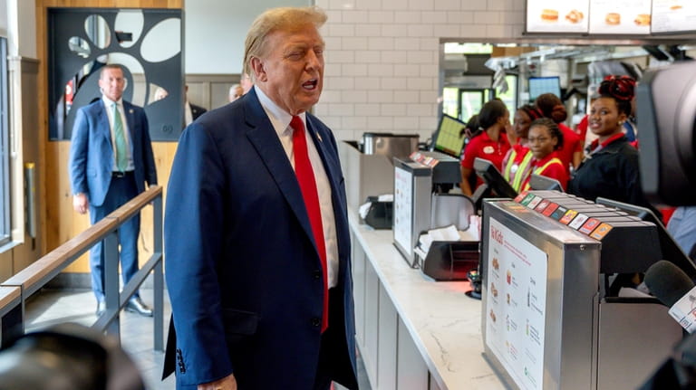 Republican presidential candidate former President Donald Trump visits a Chick-fil-A...