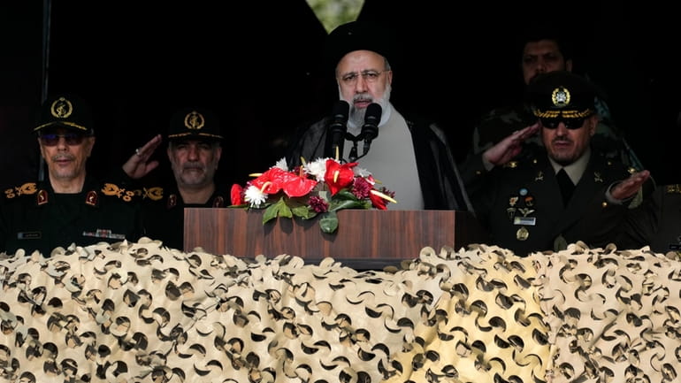 Iranian President Ebrahim Raisi speaks during Army Day parade at...