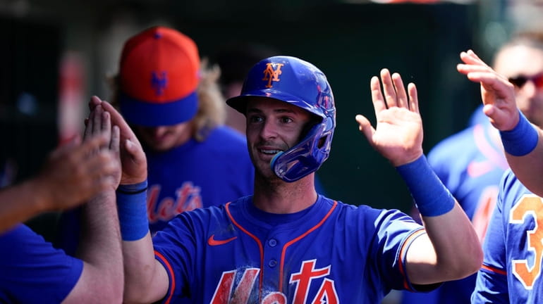 Zack Short #74 of the Mets celebrates scoring against the...