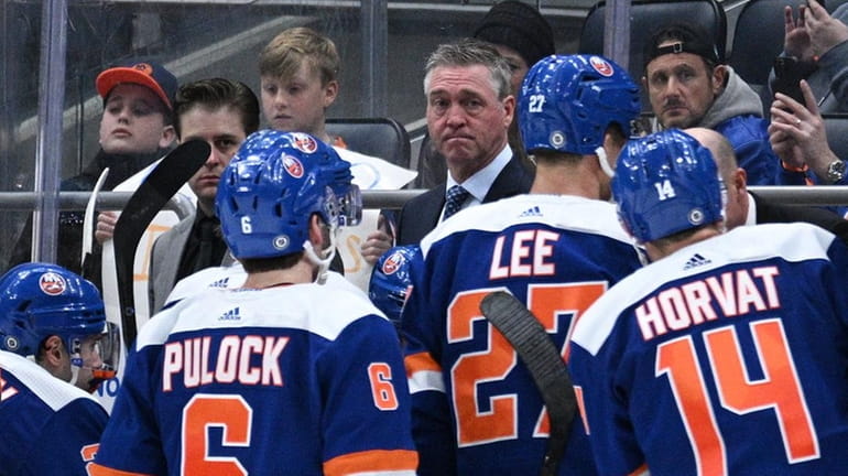 Islanders head coach Patrick Roy looks on in the third...