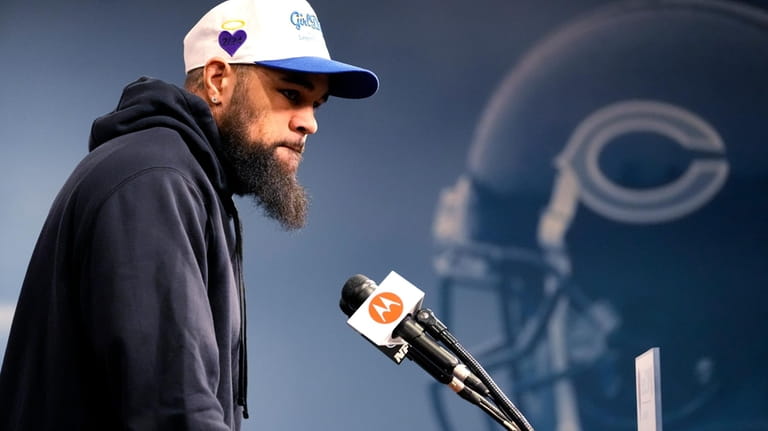 Chicago Bears wide receiver Keenan Allen listens to reporters at...