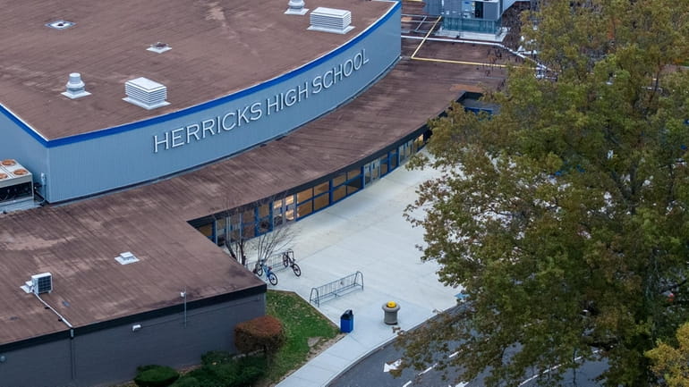 The Herricks school district reached a tentative settlement Wednesday with...